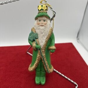 vintage‎ glass Christmas ornament depicting Santa Claus dressed in green